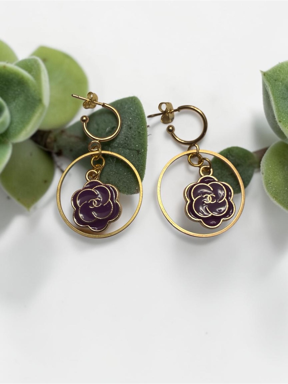 Chanel purple flower zipper pulls made into earrings